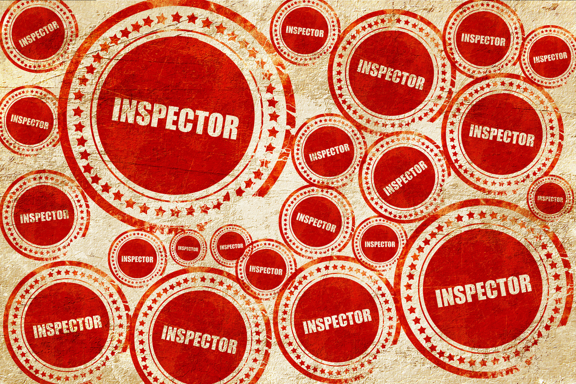 inspector, red stamp on a grunge paper texture
